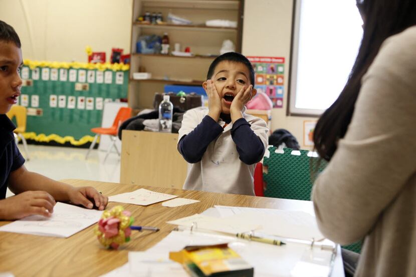 Prekindergarten student Julio Medina demonstrates the emotion of fear while working on his...