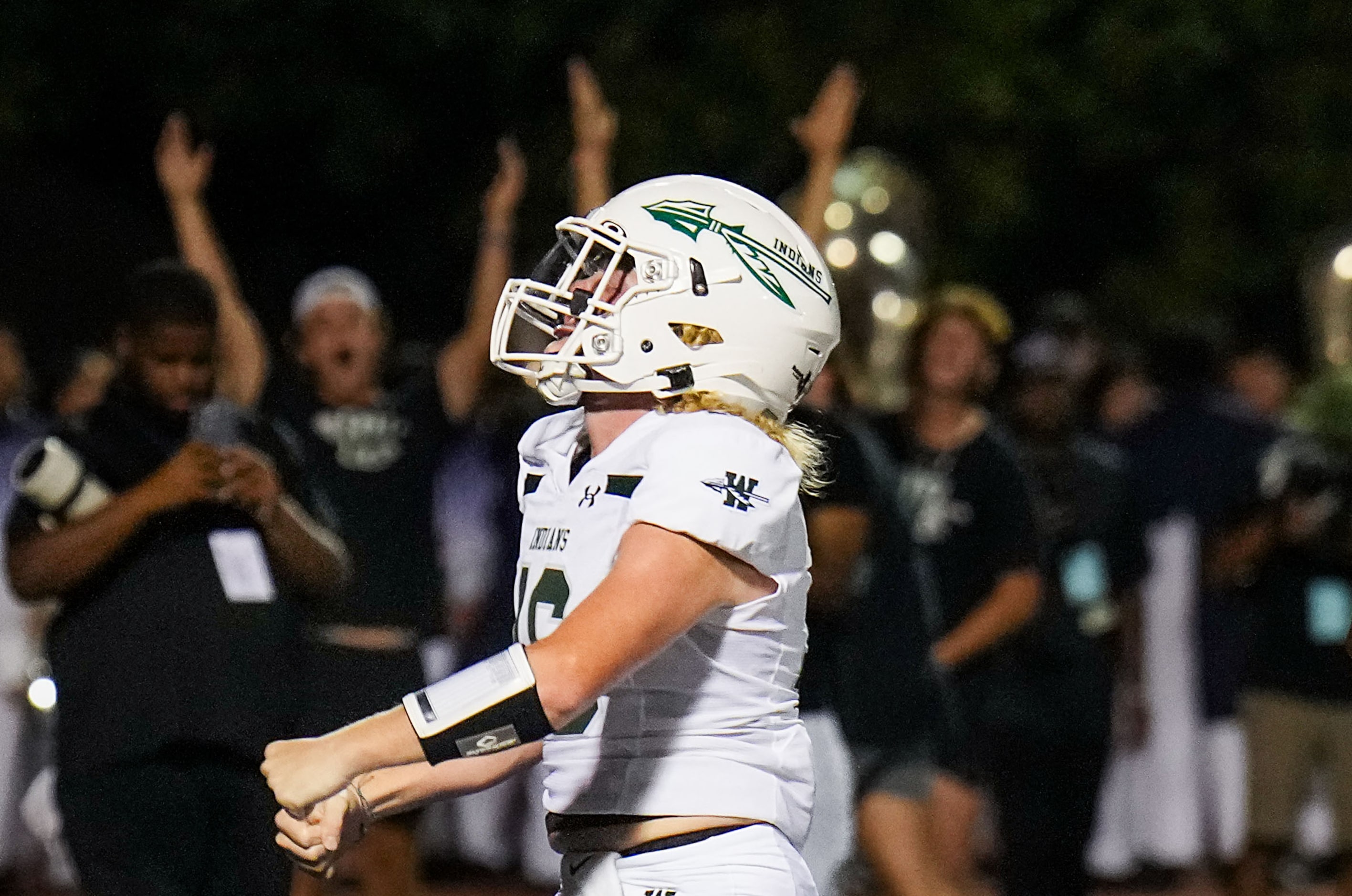 Waxahachie quarterback Nolan Barnard (16) celebrates after a short touchdown run during the...