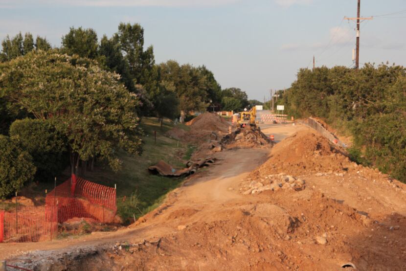 To cope with increased vehicle and bicycle traffic in Flower Mound, the city is building new...