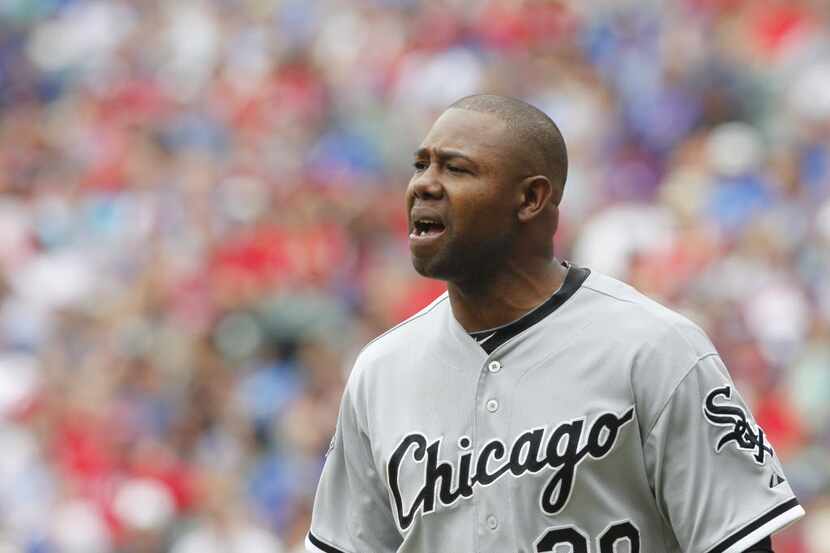 Chicago White Sox left fielder Alejandro De Aza (30) yells after he was called out because...