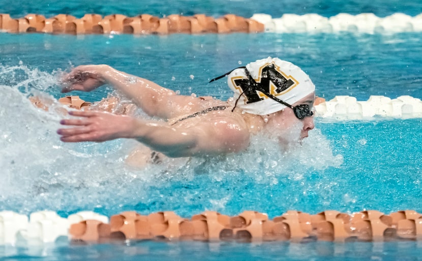 Mansfield’s Katie Walker, competes in the 100 butterfly during the 2023 UIL Swim & Dive...