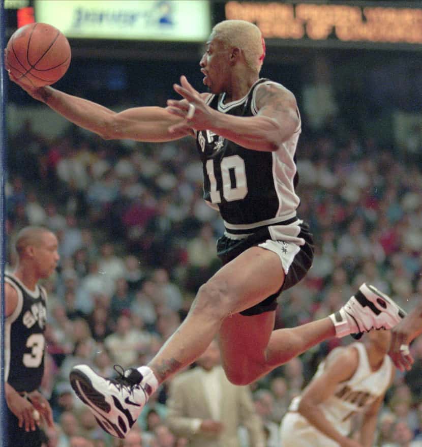 This May 1, 1995, file photo shows San Antonio Spurs forward Dennis Rodman flying through...
