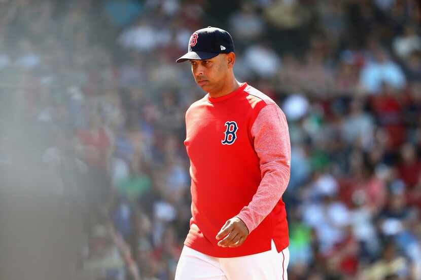 BOSTON, MA - MAY 02:  Manager Alex Cora #20 of the Boston Red Sox walks to the dugout during...