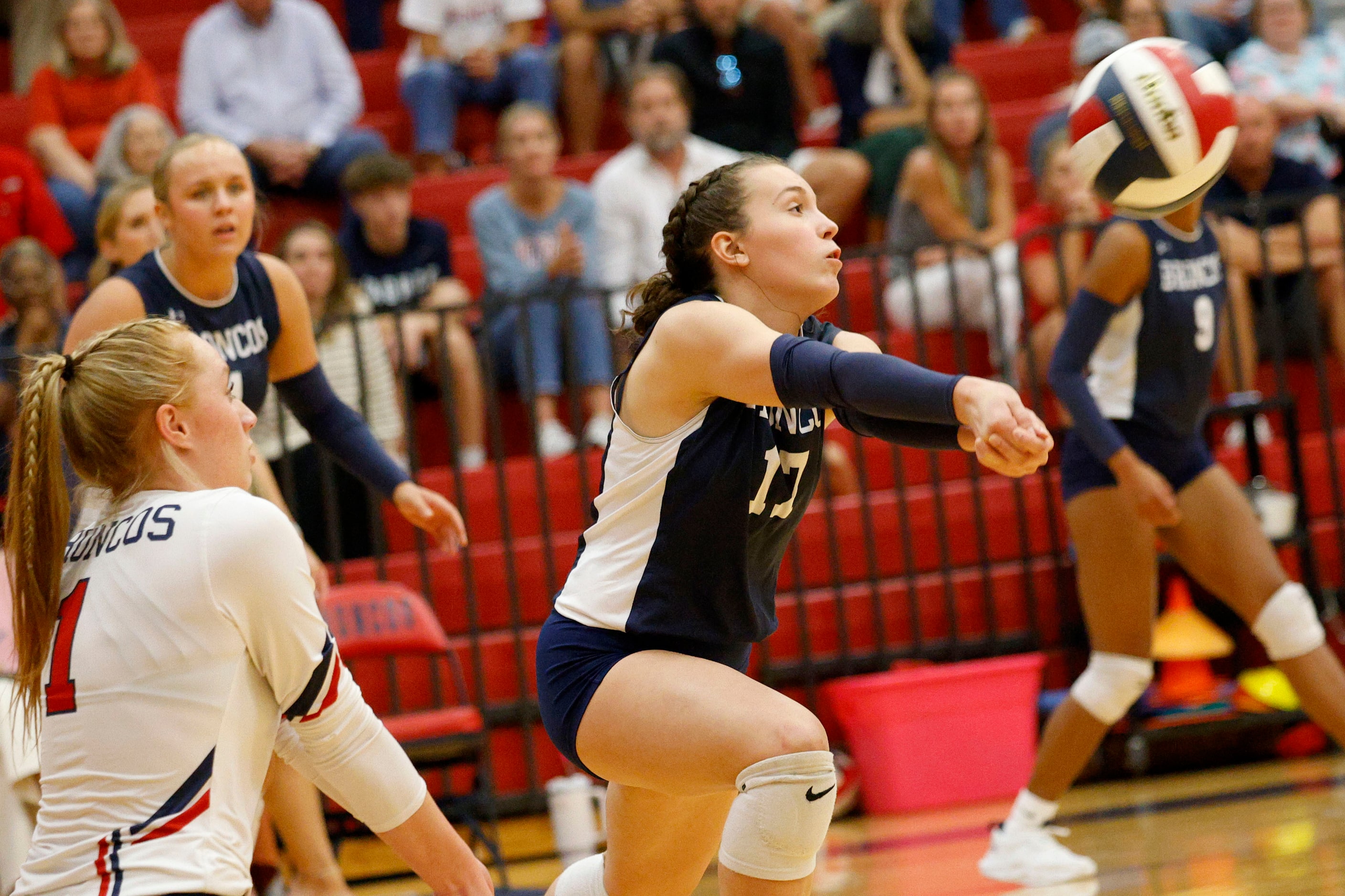 McKinney Boyd's Kam Williams (17) digs the ball against Plano East as her teammates Ale Romo...