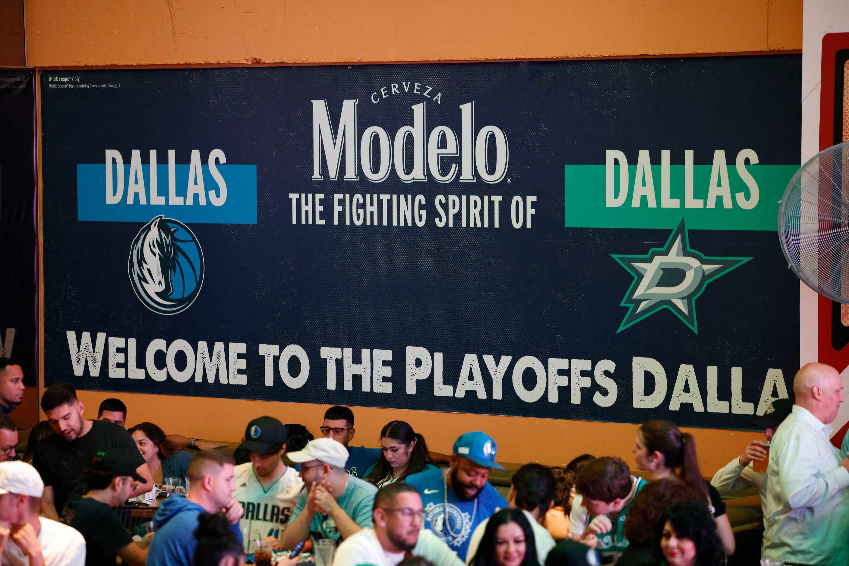 A sign that reads “ Welcome to the Playoffs Dallas, “ is seen during a Game 1 watch party of...