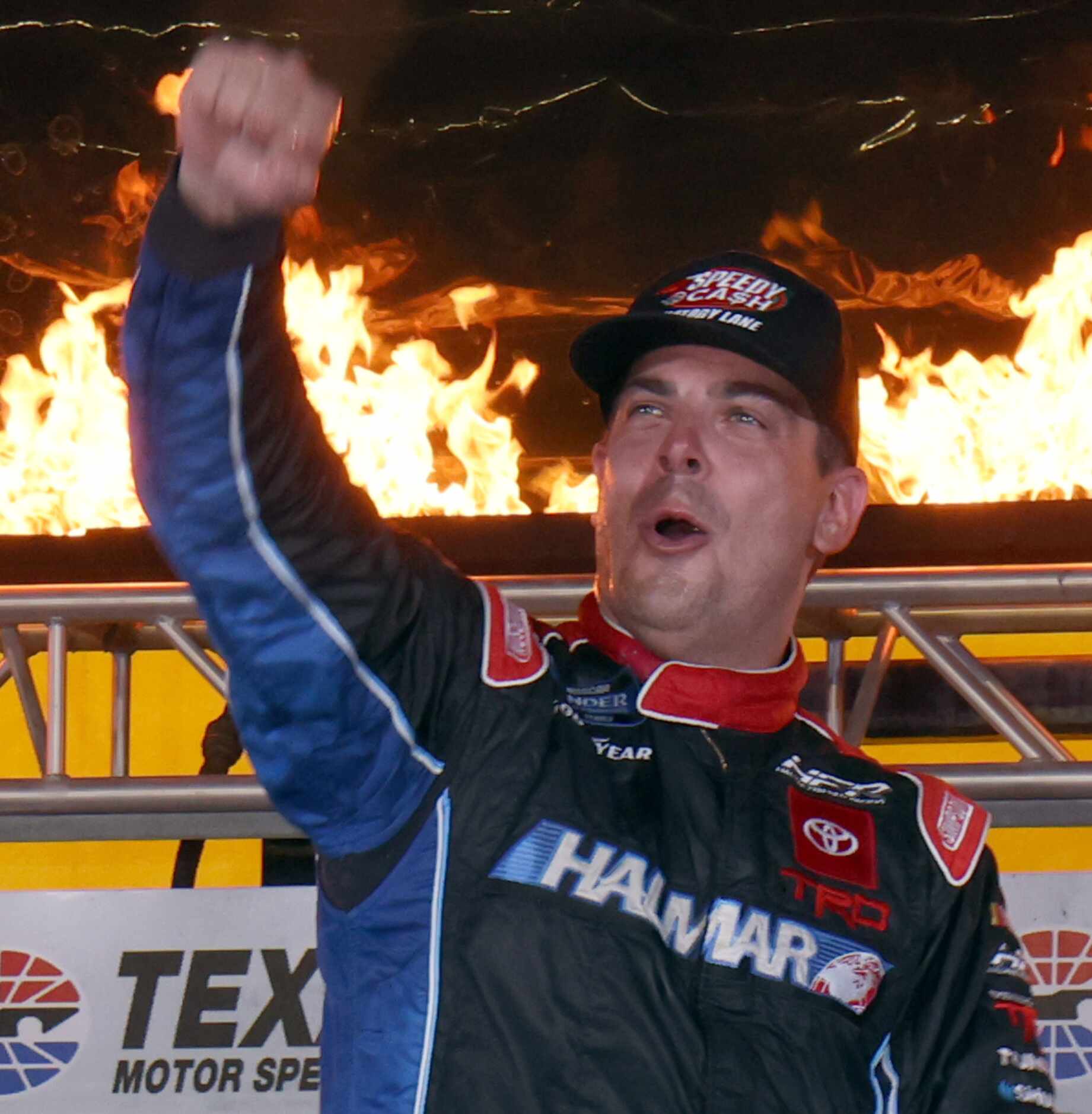 Driver Stewart Friesen pumps his first in the air after retaking the lead in the final laps...