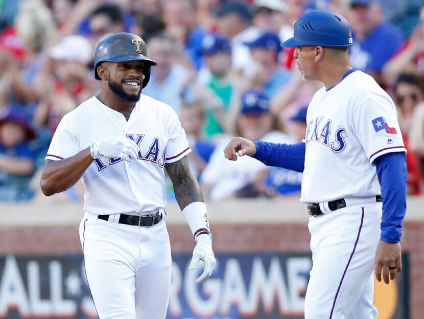 Texas Rangers left fielder Delino DeShields (3) and Texas Rangers first base coach Hector...