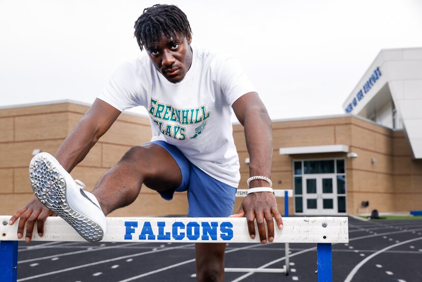 North Forney High School senior Alexander Chukwukelu leans against a hurdle for a portrait...