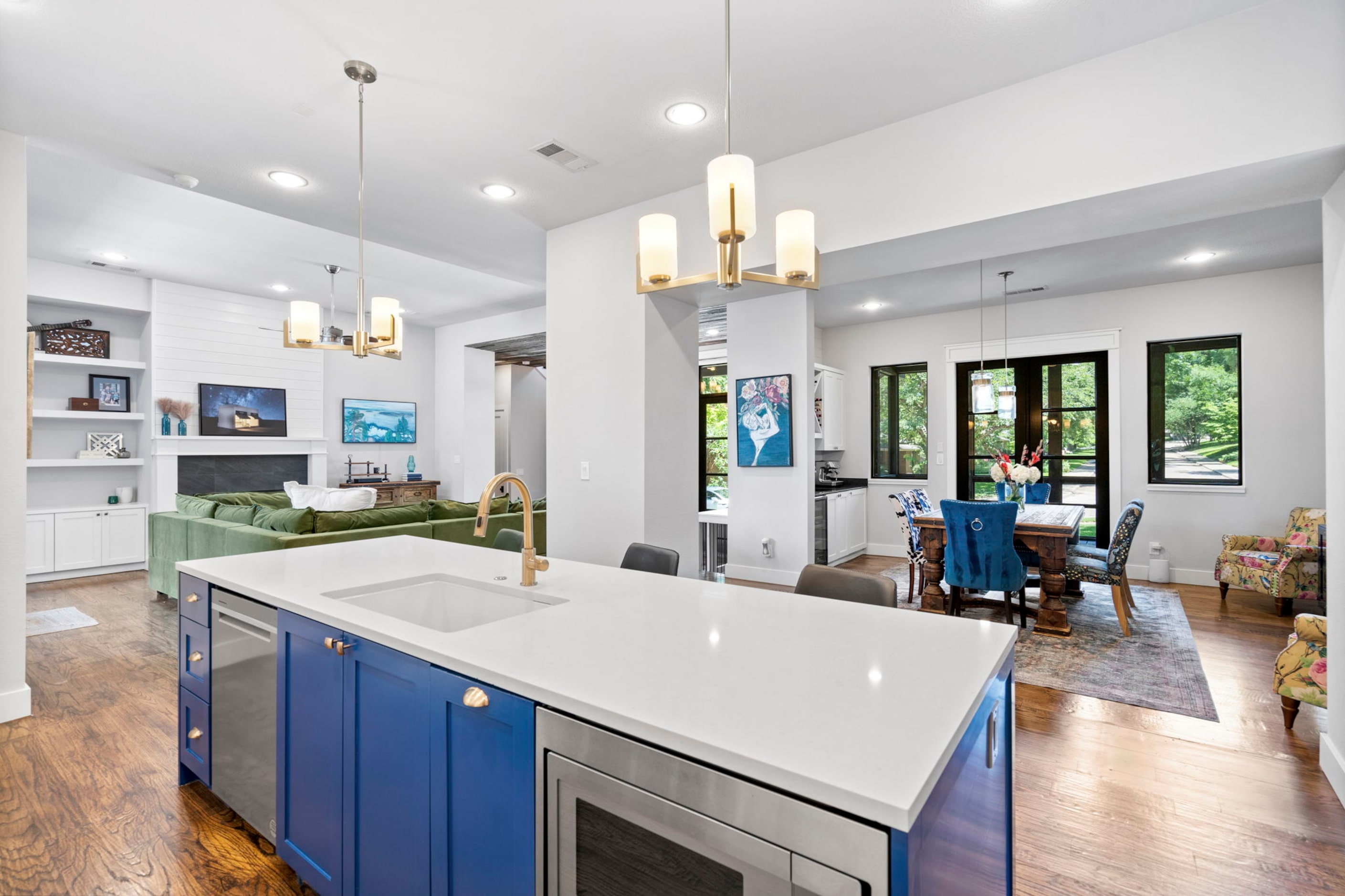 Bright blue cabinetry draws the eye in the kitchen.