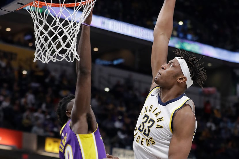 Indiana Pacers' Myles Turner dunks against Los Angeles Lakers' Julius Randle during the...