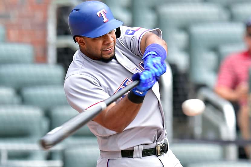 ATLANTA, GA - SEPTEMBER 6: Elvis Andrus #1 of the Texas Rangers hits a first inning solo...