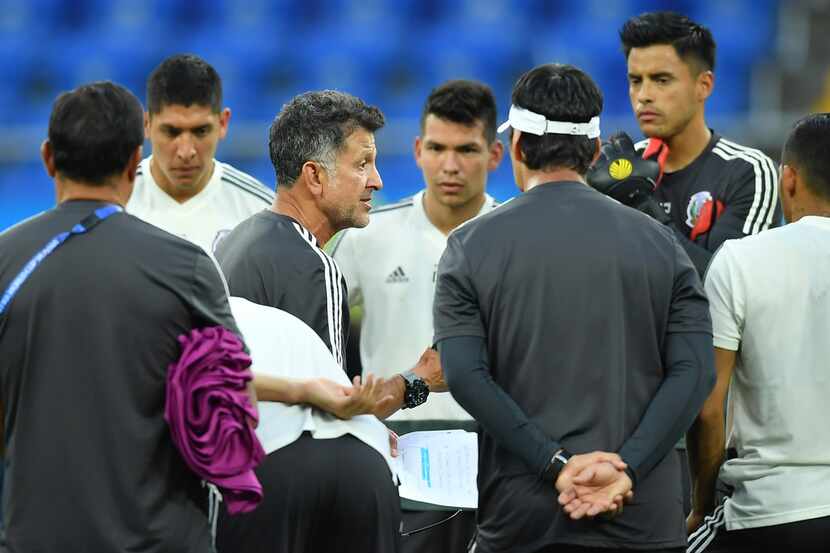 ROSTOV, RUSSIA - JUNE 22: Juan Carlos Osorio, coach of Mexico, talks with his players during...