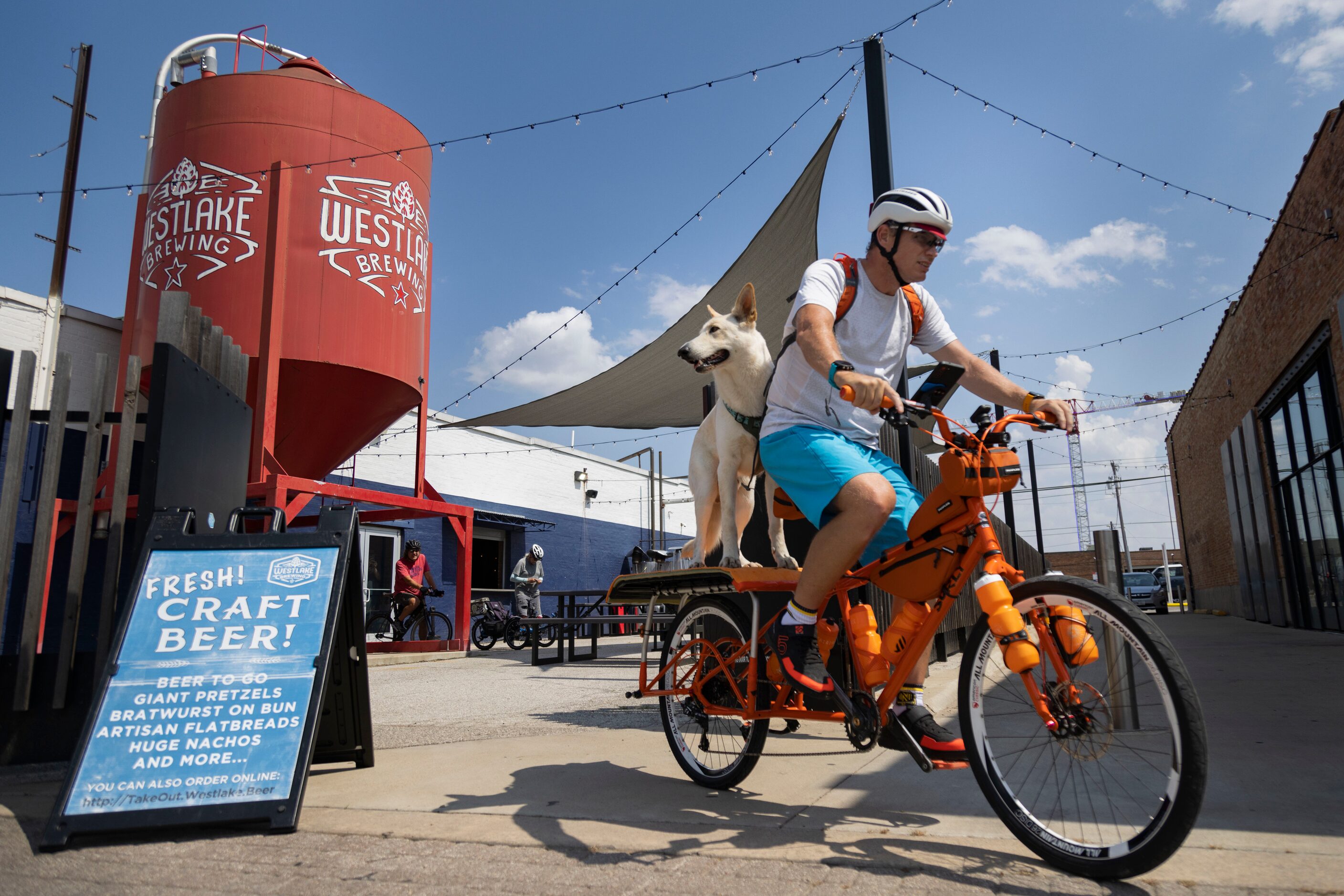 David Walker of Garland and his dog Balu head out for a bike ride after stopping at Westlake...