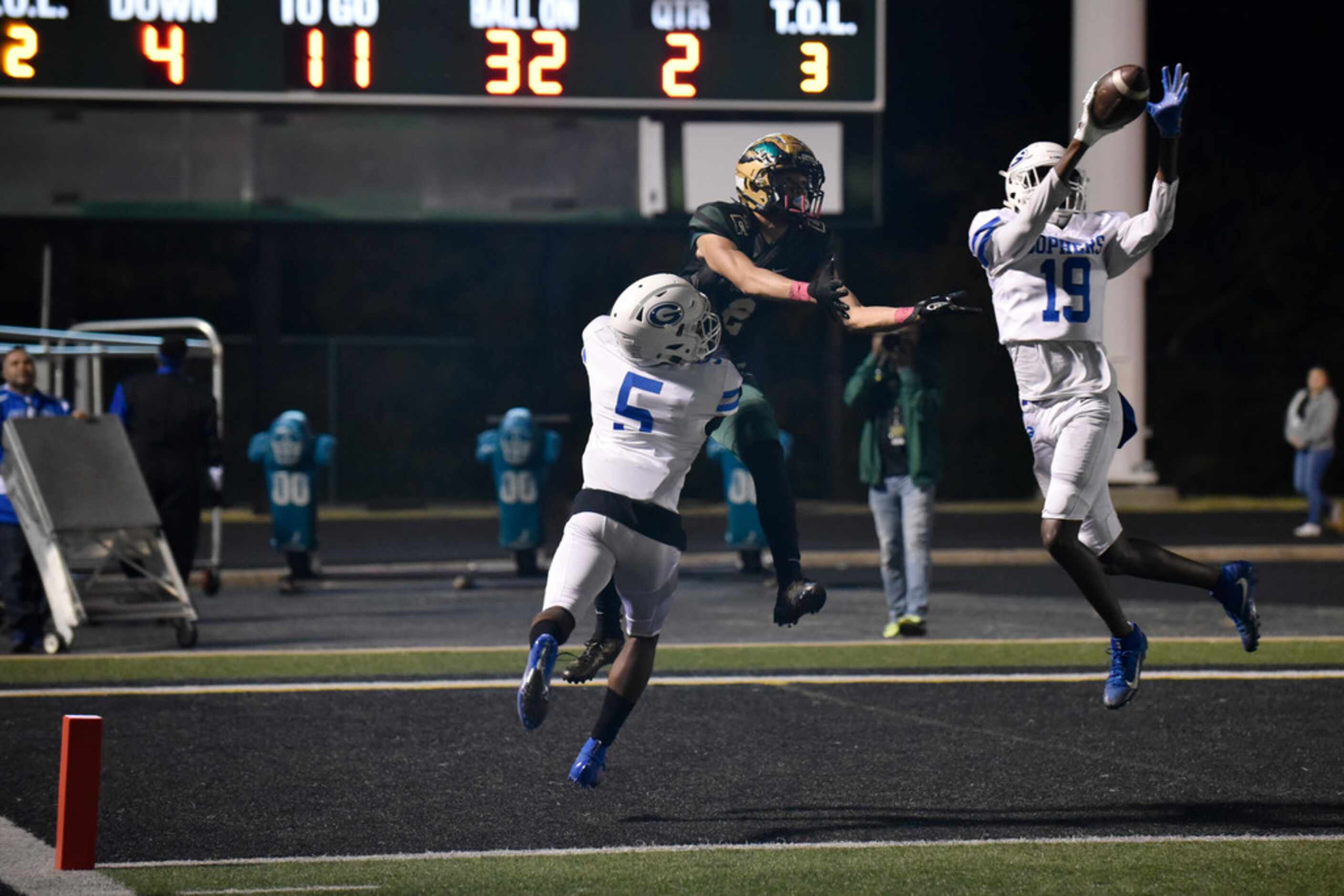 Grand Prairie High School defensive back junior Lamar Champ (19) catches a pass for an...