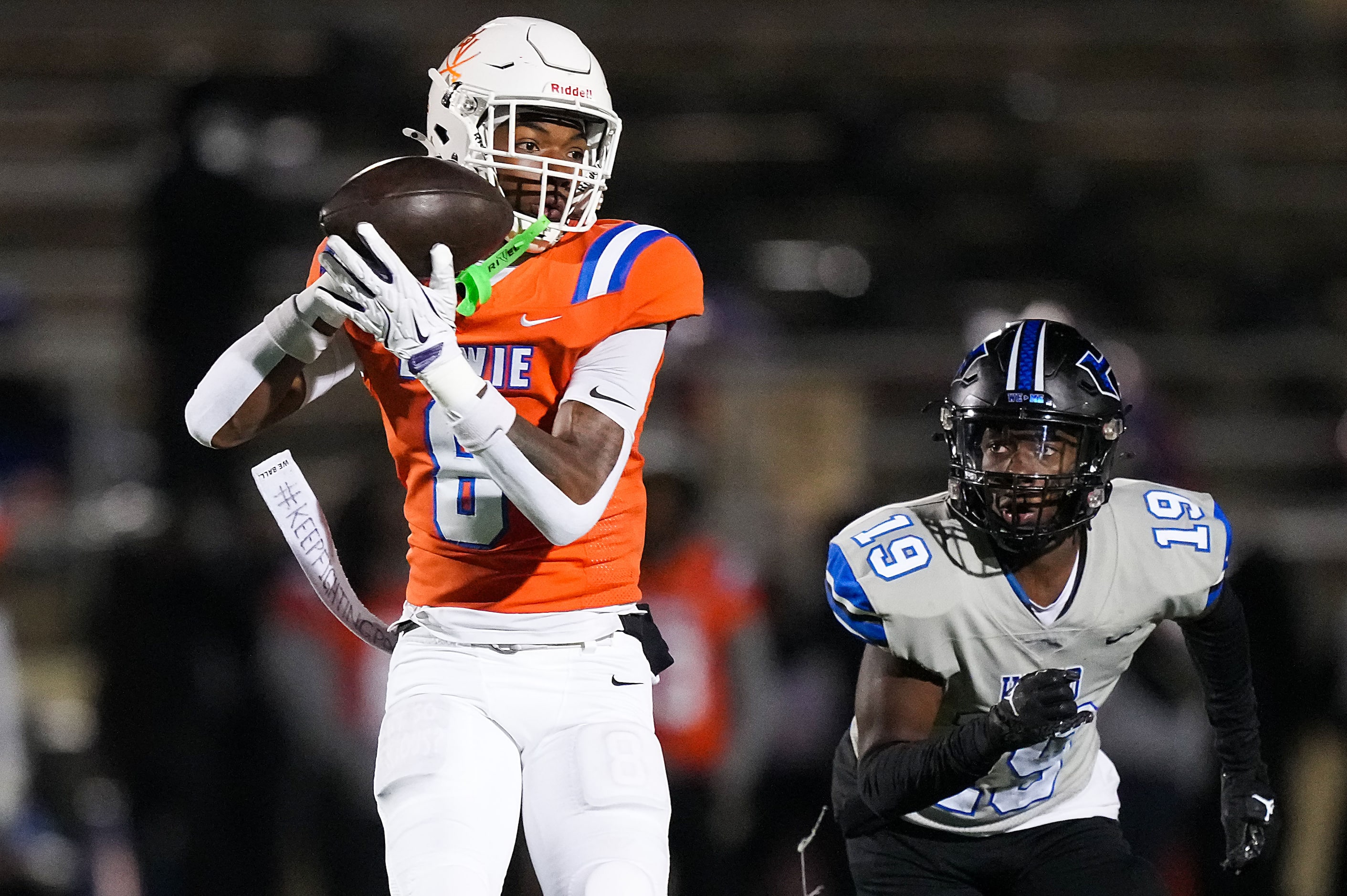 Arlington Bowie wide receiver Dilon Tallie (8) catches a pass as Hebron defensive back Kylan...