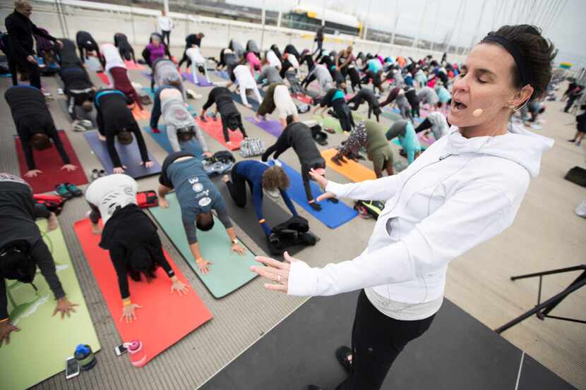 Jennifer Lawson of Sync Yoga & Wellbeing leads Yoga on the Bridge during the All-Out Trinity...