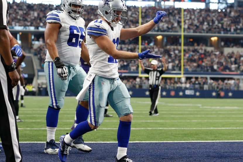 Dallas Cowboys wide receiver Cole Beasley (11) celebrates a touchdown against Baltimore...