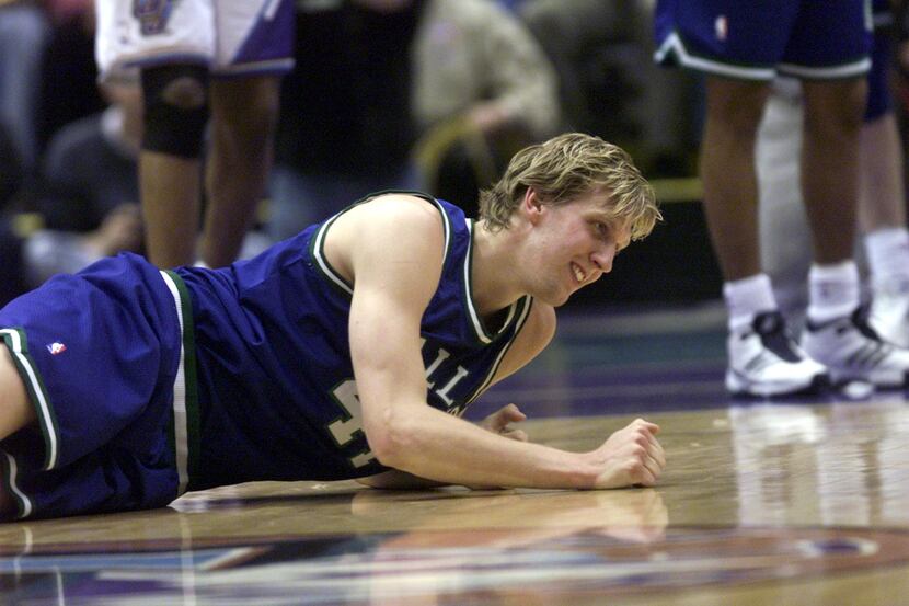 Dallas Mavericks power forward Dirk Nowitzki (41) with his head down after missing a field...
