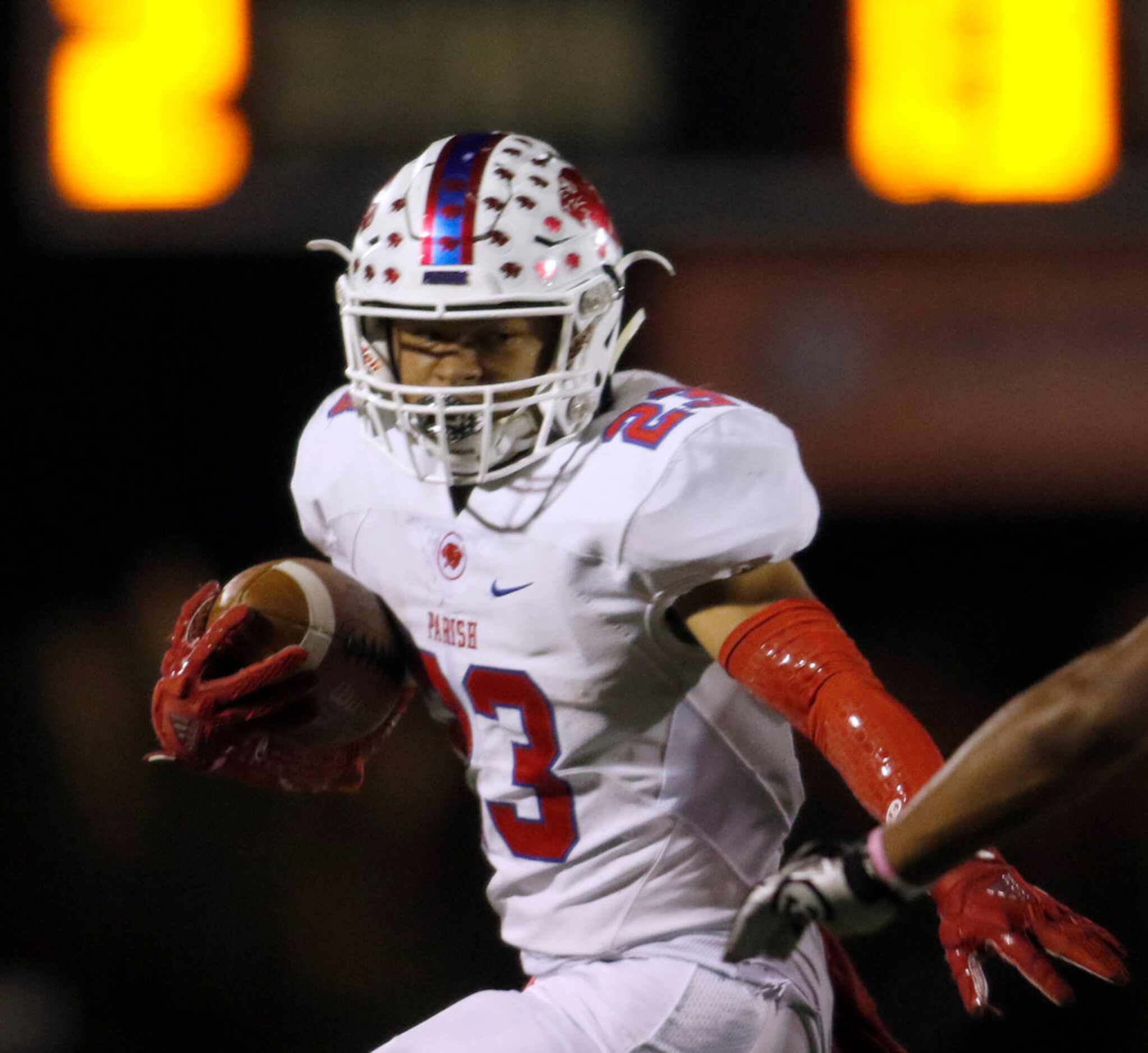 Parish Episcopal running back Christian Benson (23) looks to tack on yardage after pulling...