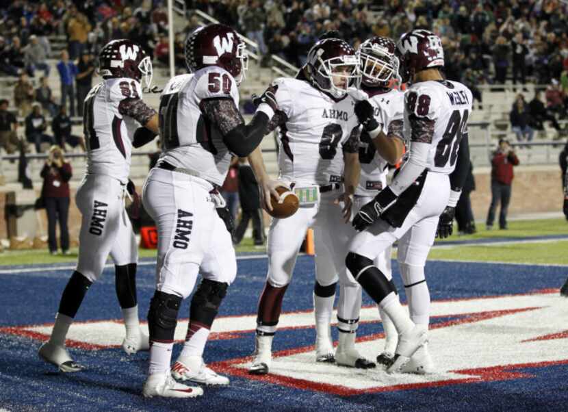 Wylie quarterback Carsen Cook (9) celebrates his touchdown with wide receiver Jordan Whaley...