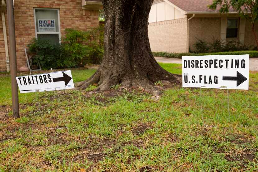 Signs put outside of Brenda Drevicky's home in response to her neighbor putting up signs...