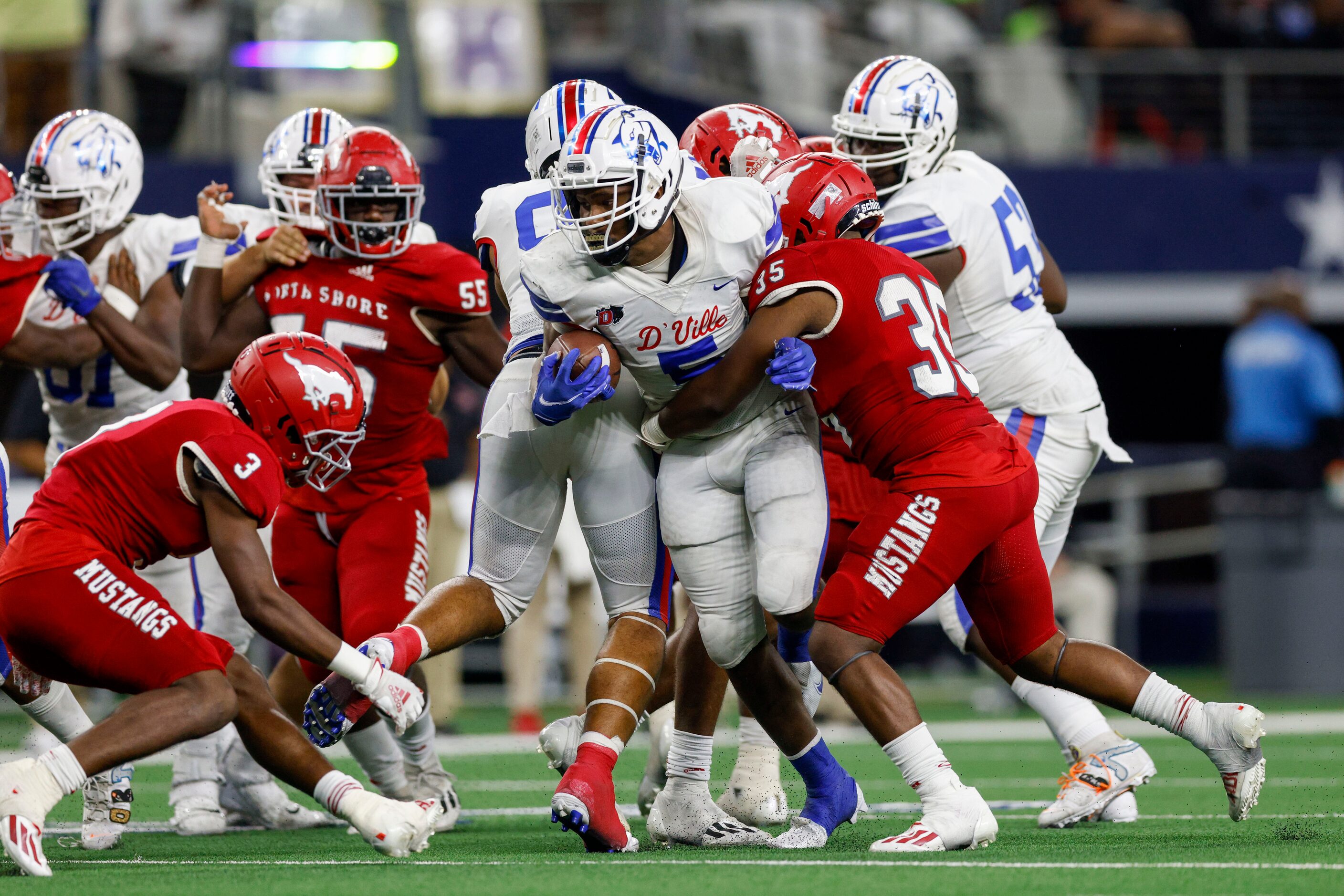 Galena Park North Shore linebacker Josh Garrett (35) tackles Duncanville running back...