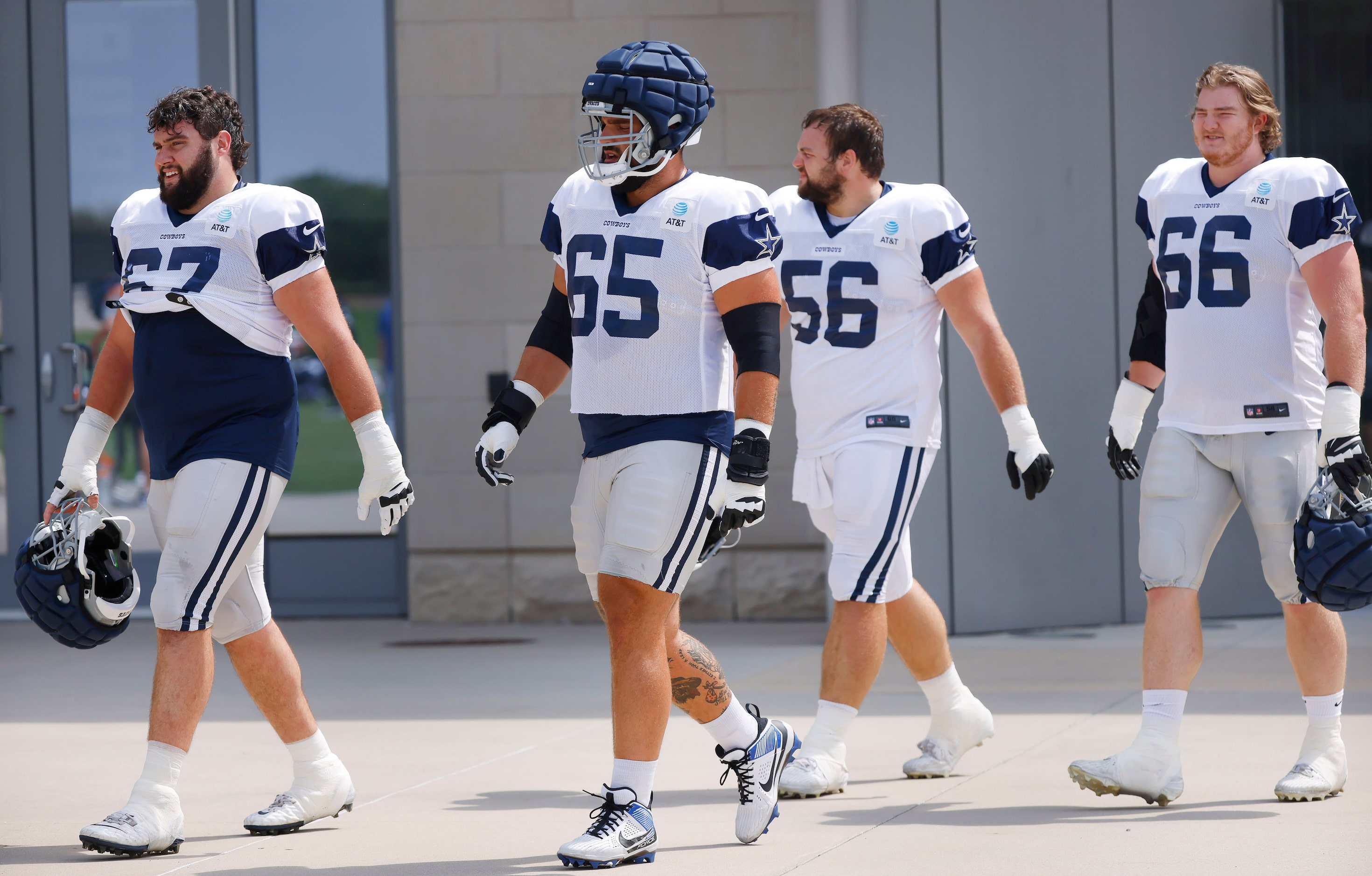 Dallas Cowboys center Brock Hoffman (67), guard Dakoda Shepley (65), center Cooper Beebe...