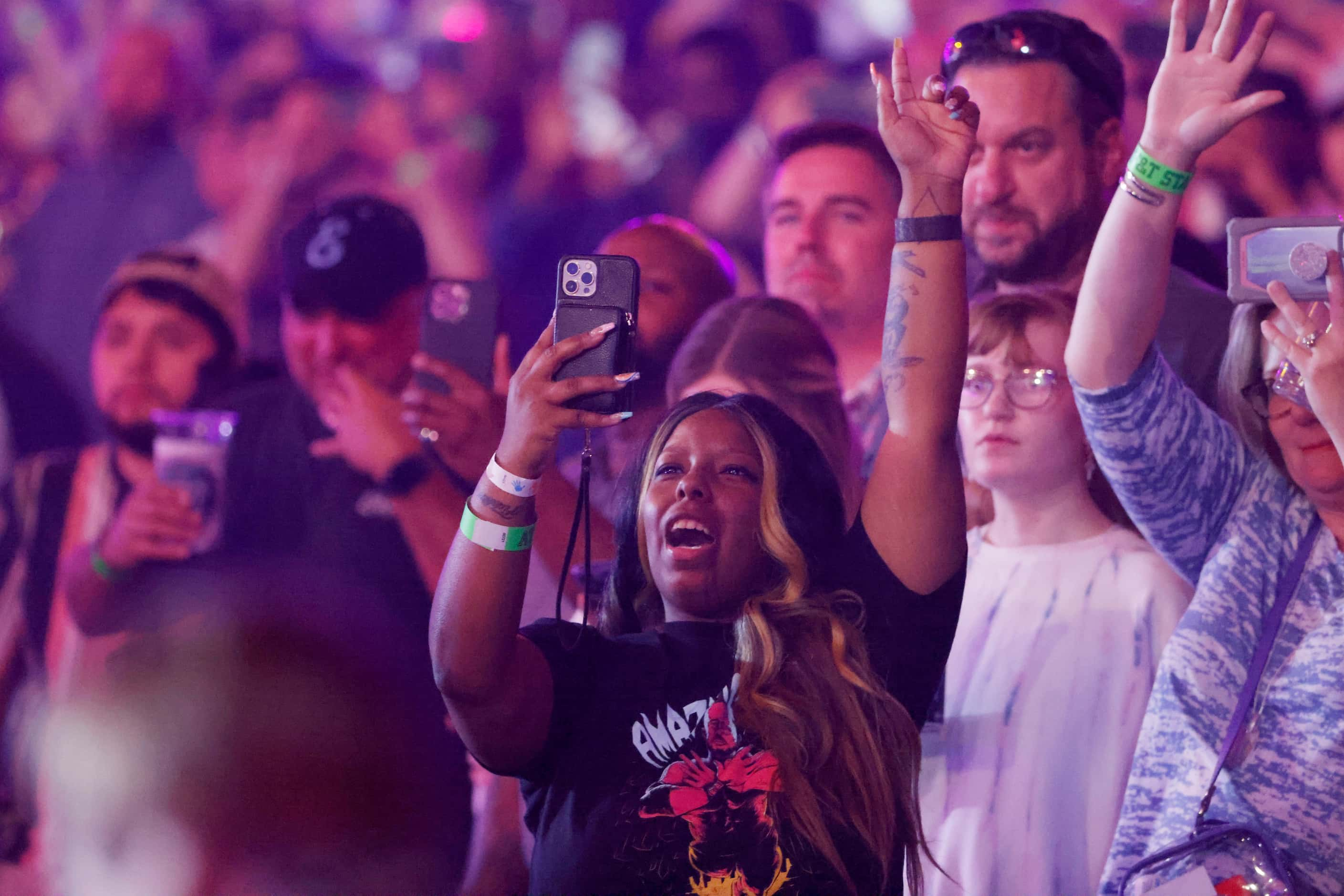 A fan cheers as the Texas Southern Marching band performs during WrestleMania in Arlington,...