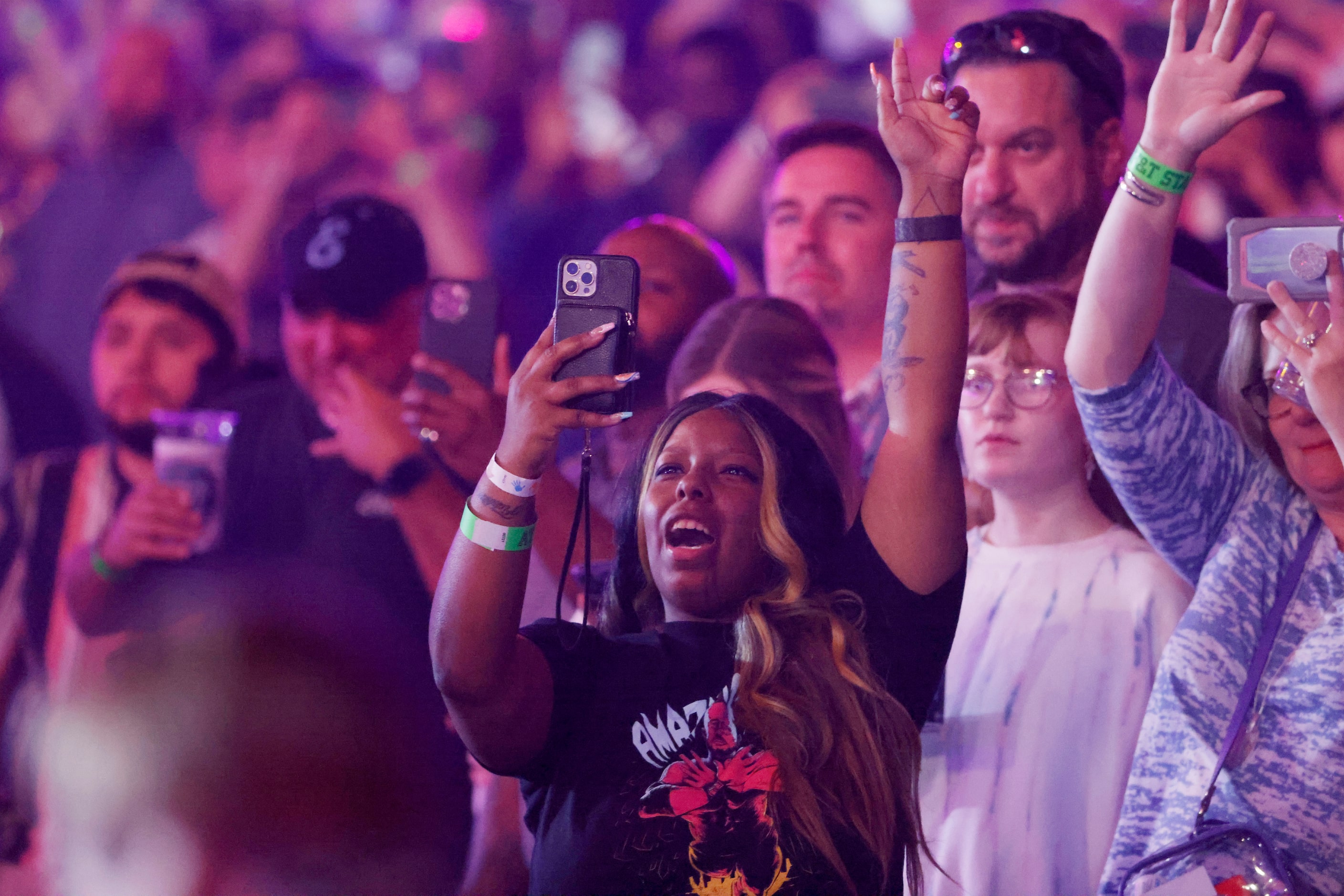 A fan cheers as the Texas Southern Marching band performs during WrestleMania in Arlington,...