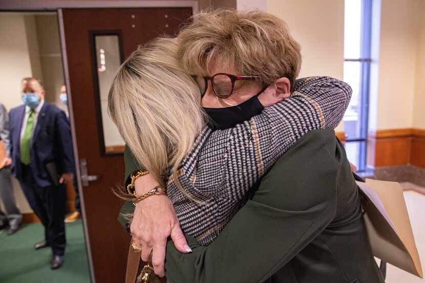 Cheryl Pangburn (left) and Shannon Dion hug after testifying before the House Committee on...
