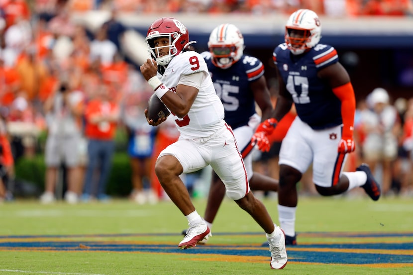 Oklahoma quarterback Michael Hawkins Jr. (9) breaks free for a touchdown against Auburn...