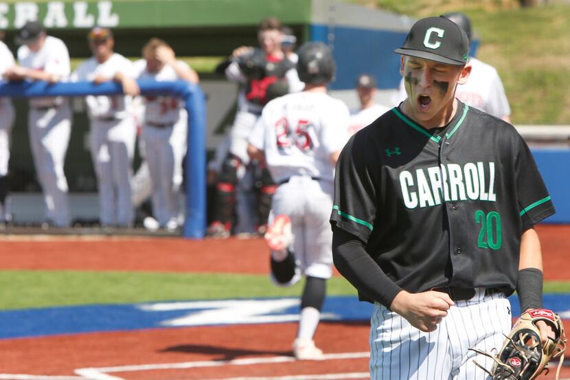 Southlake Carroll third baseman Cade Manning lets out a yell after snagging a high hopper...