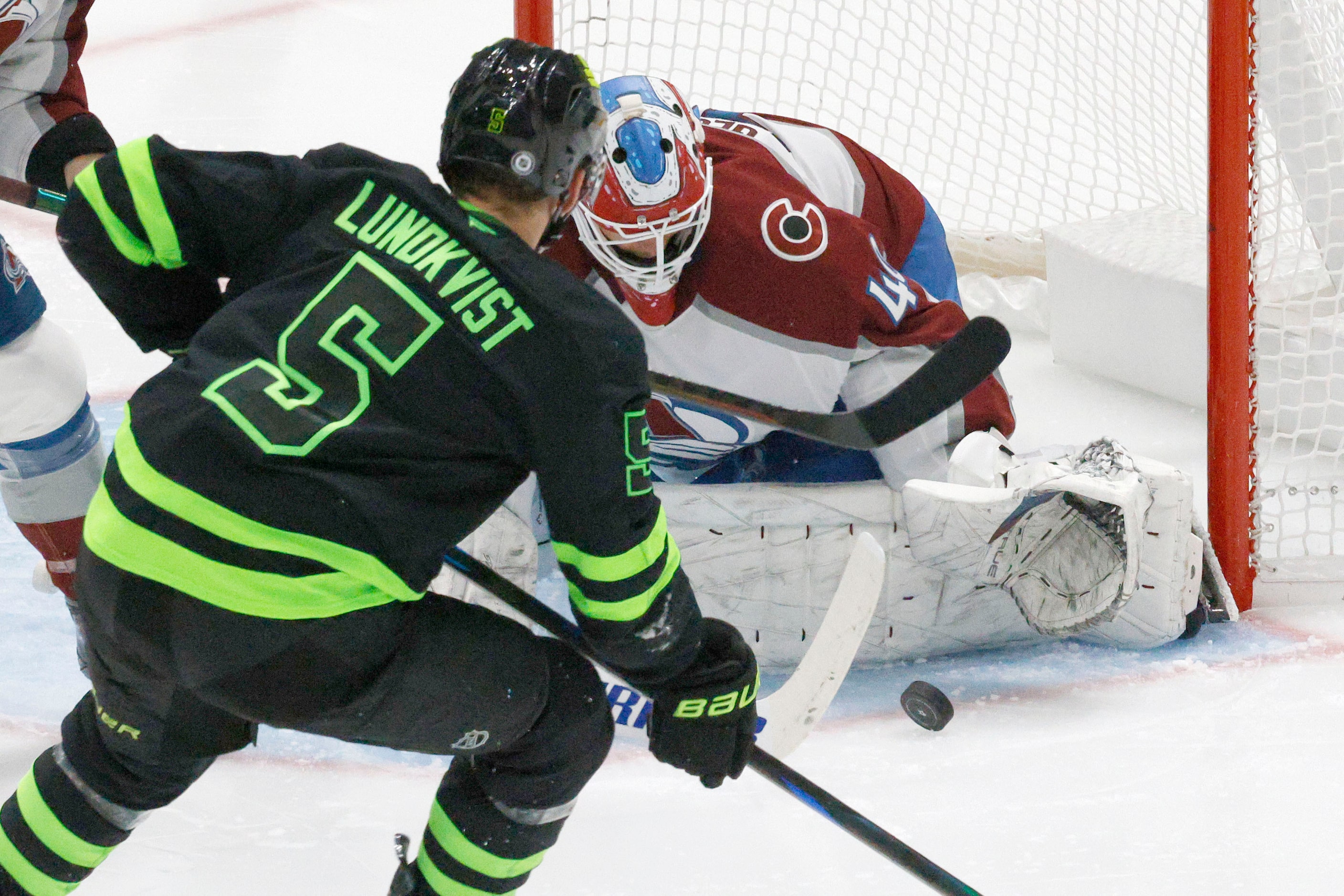 Dallas Stars defenseman Nils Lundkvist (5) tries to shoot against Colorado Avalanche...