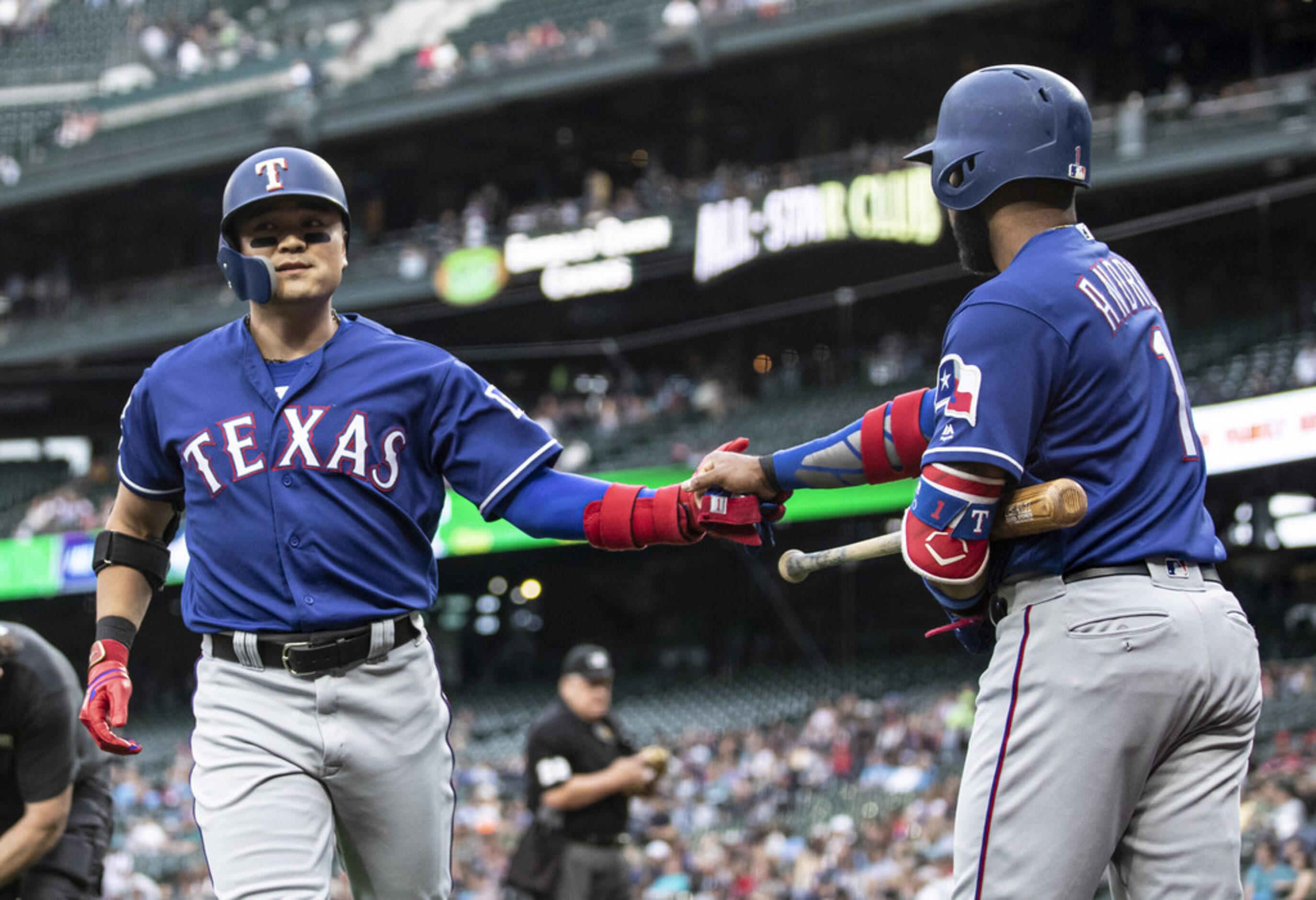 SEATTLE, WA - JULY 23: Shin-Soo Choo #17 of the Texas Rangers is congratulated by teammate...