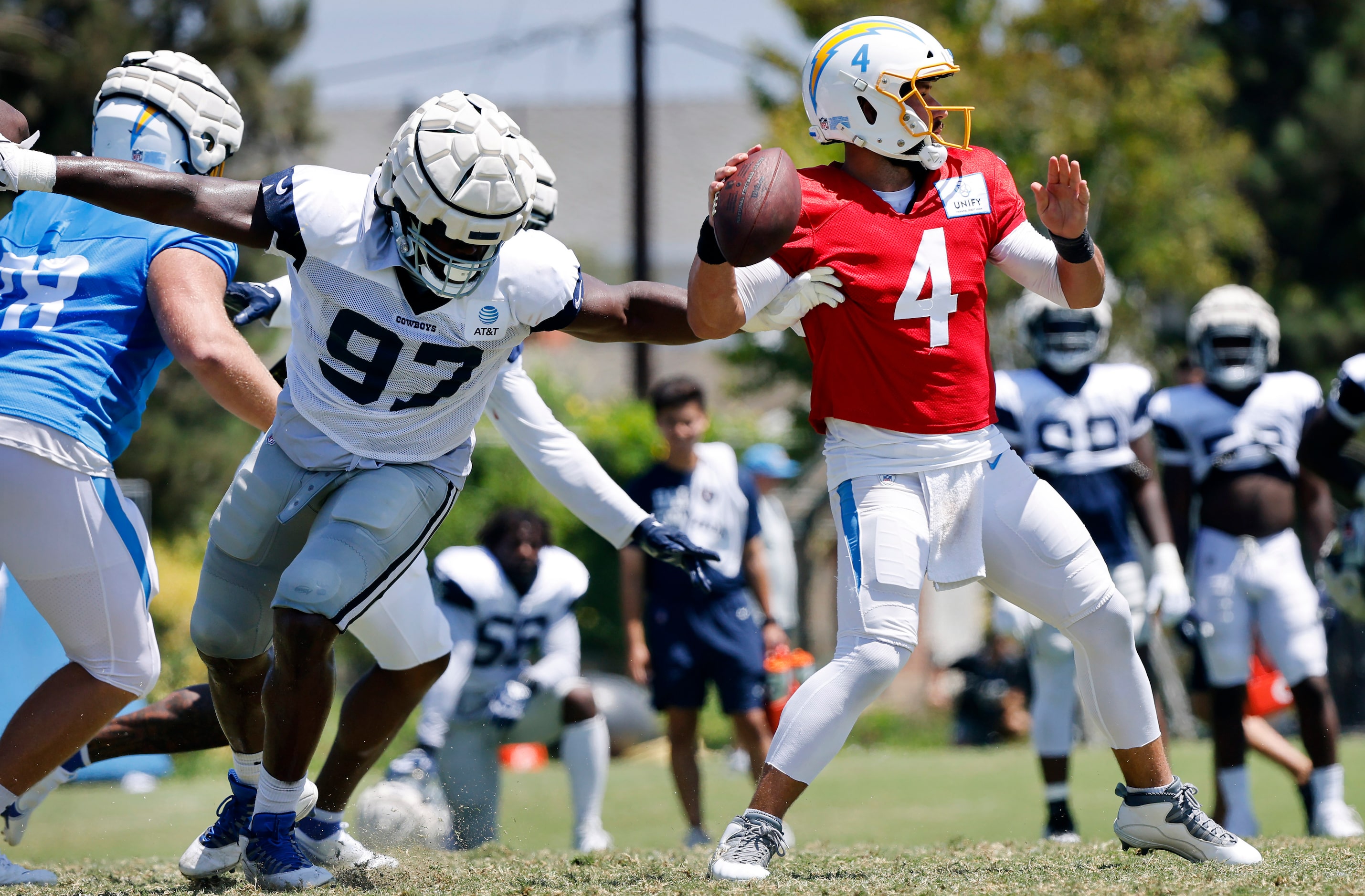 Dallas Cowboys defensive tackle Osa Odighizuwa (97) gets to Los Angeles Chargers quarterback...