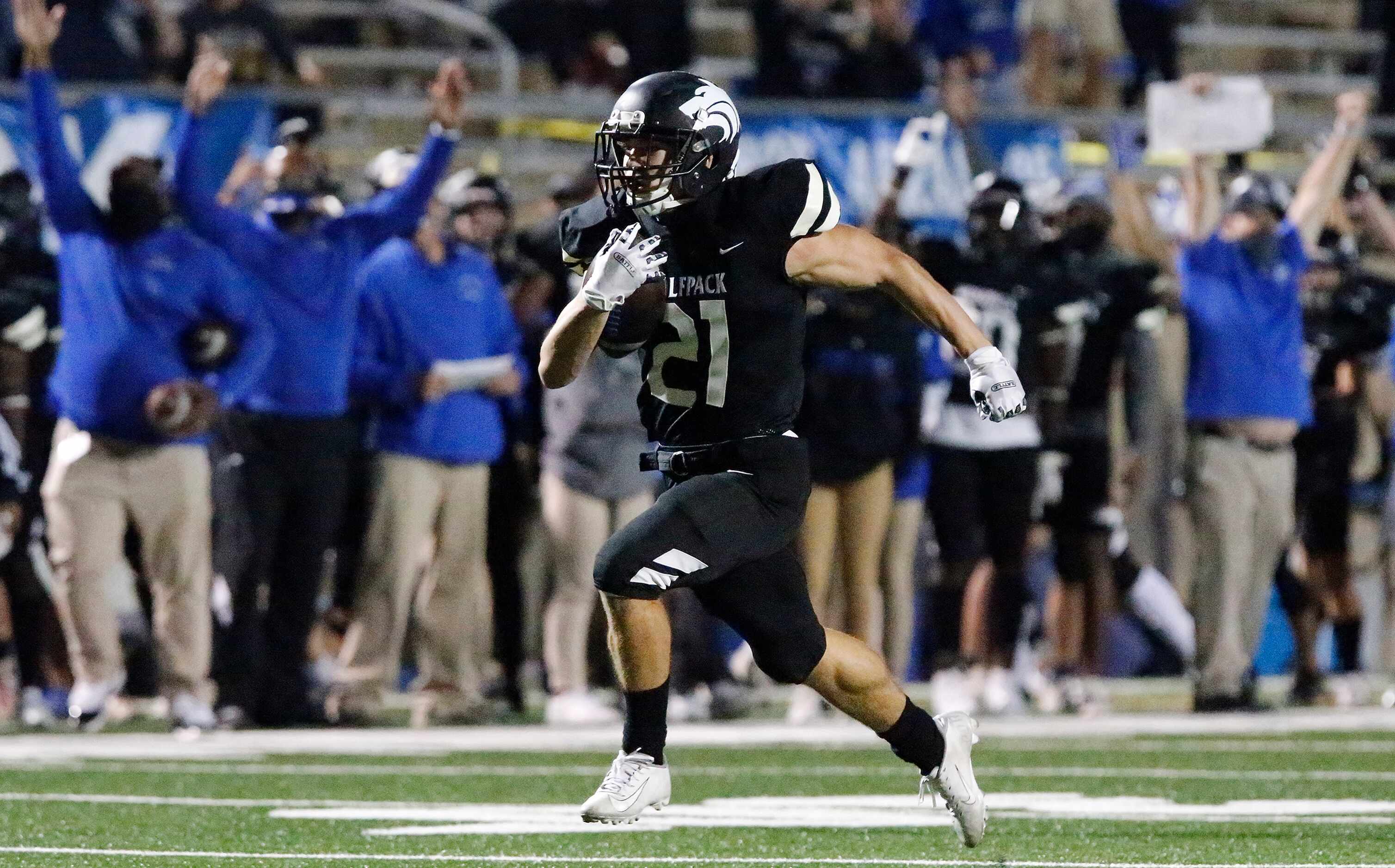 Plano West High School running back Dermot White (21) sprints to the end zone for the first...