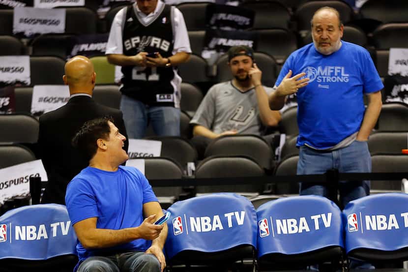 Dallas Mavericks owner Mark Cuban visits with a fan before the NBA Western Conference...