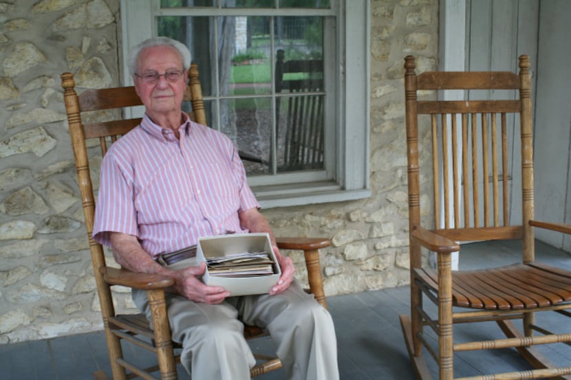 George Dennis Jr., 89, sits on the porch of the home where he was born, now the Gilbert...