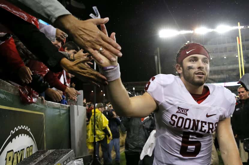 Oklahoma quarterback Baker Mayfield (6) greets fans after their NCAA college football game...