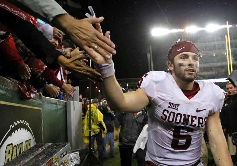 Oklahoma quarterback Baker Mayfield (6) greets fans after their NCAA college football game...