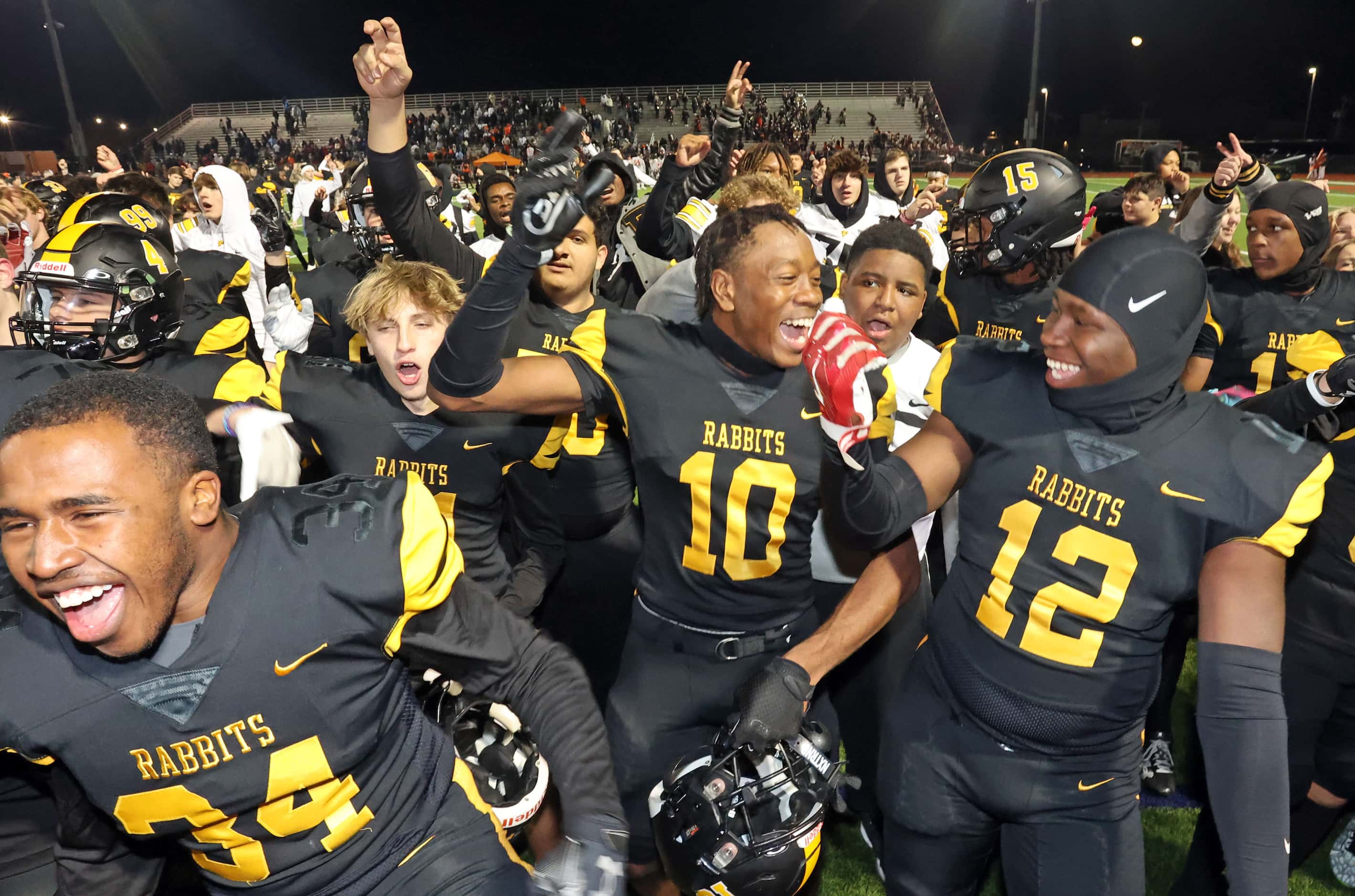Forney high’s Kofi Eduful  (10) and teammates celebrate, after the team’s Regional...
