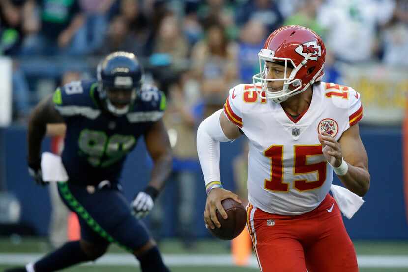 Kansas City Chiefs quarterback Patrick Mahomes (15) looks to pass as Seattle Seahawks...
