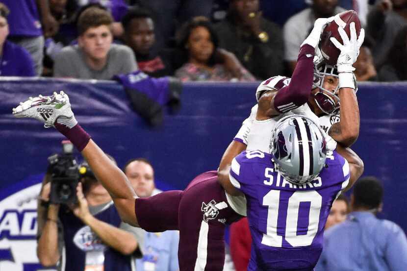 Texas A&M wide receiver Josh Reynolds catches a touchdown pass over Kansas State defensive...