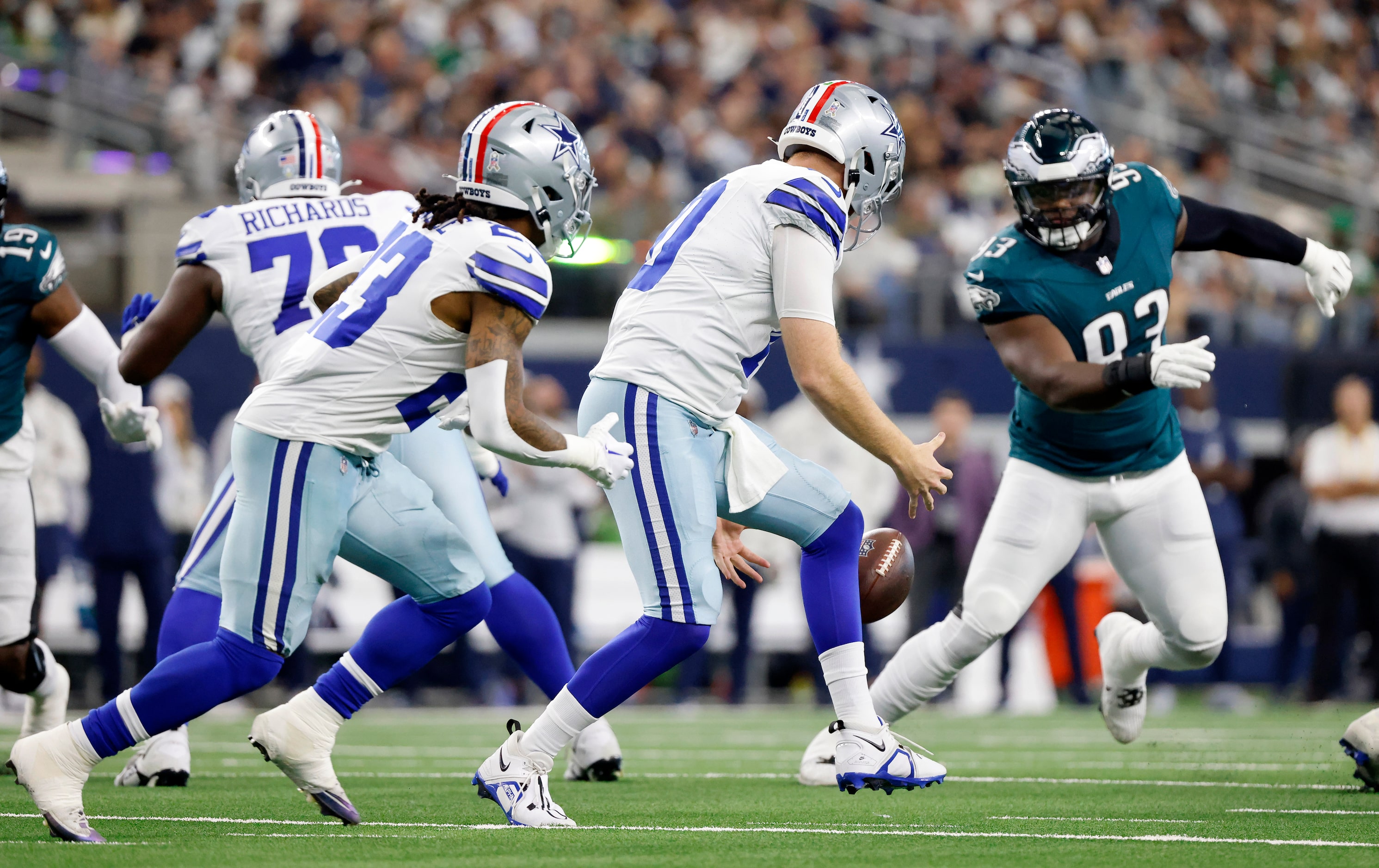 Dallas Cowboys quarterback Cooper Rush (10) fumbles the ball on a first quarter snap against...