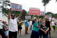 Supporters for Texas House District 21 candidates Dade Phelan and David Covey vie to have...