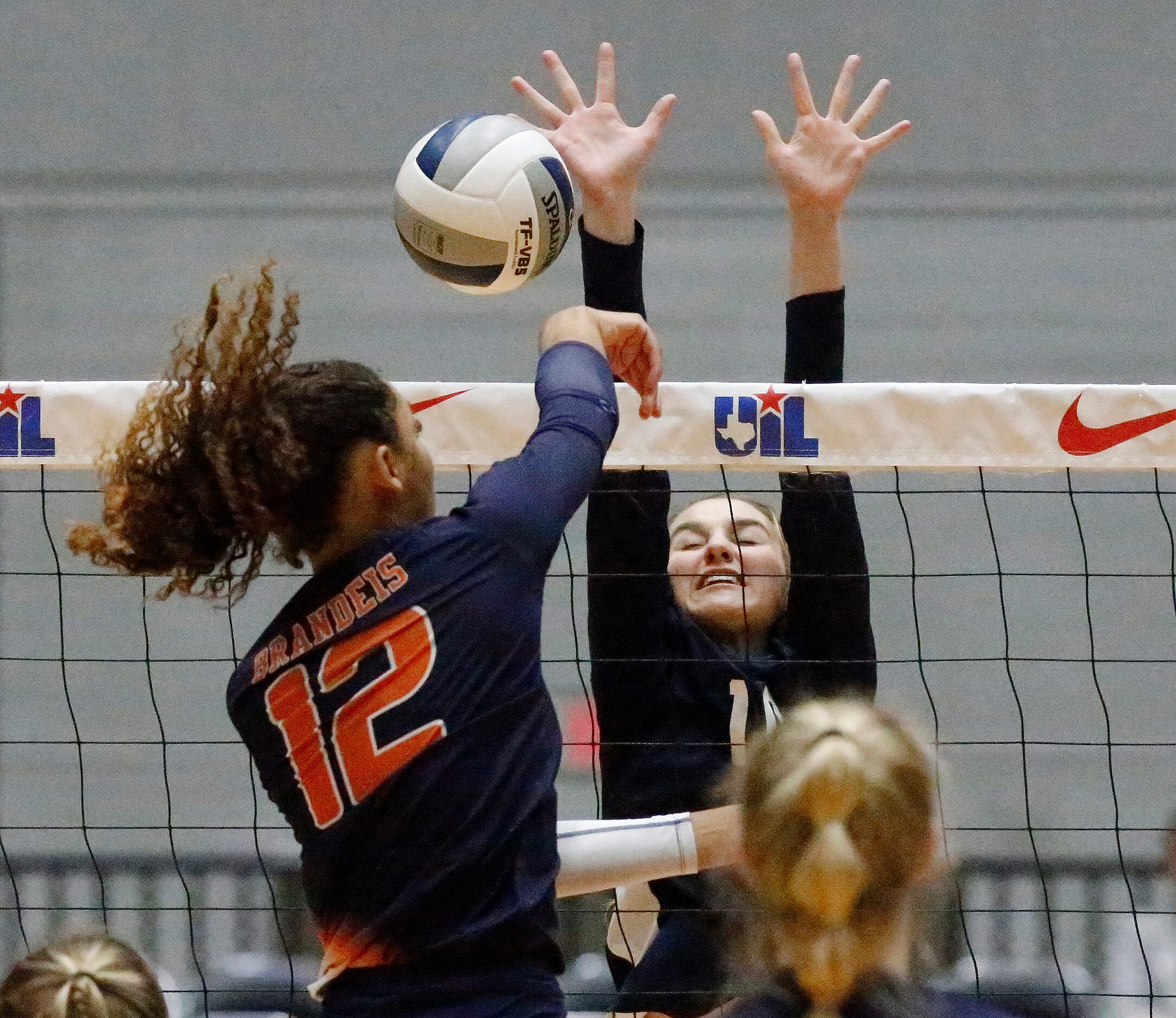 Northside Brandeis outside hitter Jalyn Gibson (12) gets a hit as Keller middle Melanie...