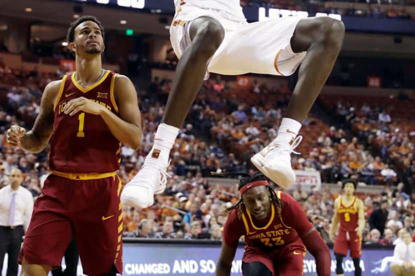 Texas forward Mohamed Bamba (4) scores as Iowa State guard Nick Weiler-Babb (1) and forward...