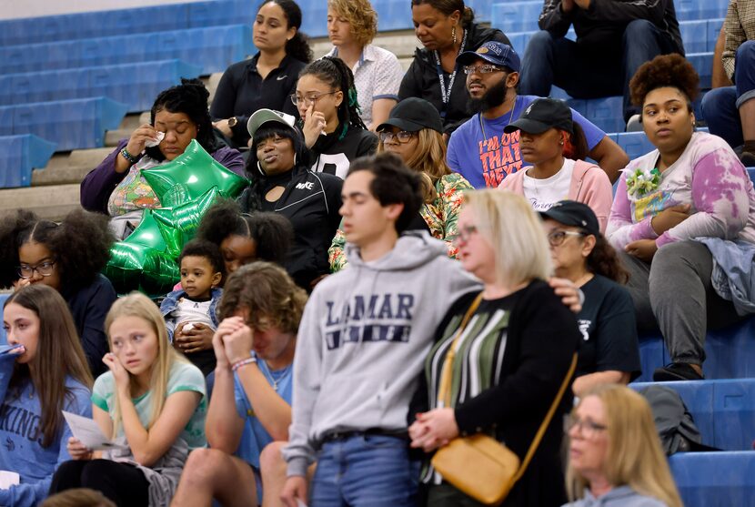 Lamar High School students, staff and community sang Amazing Grace during a memorial for...