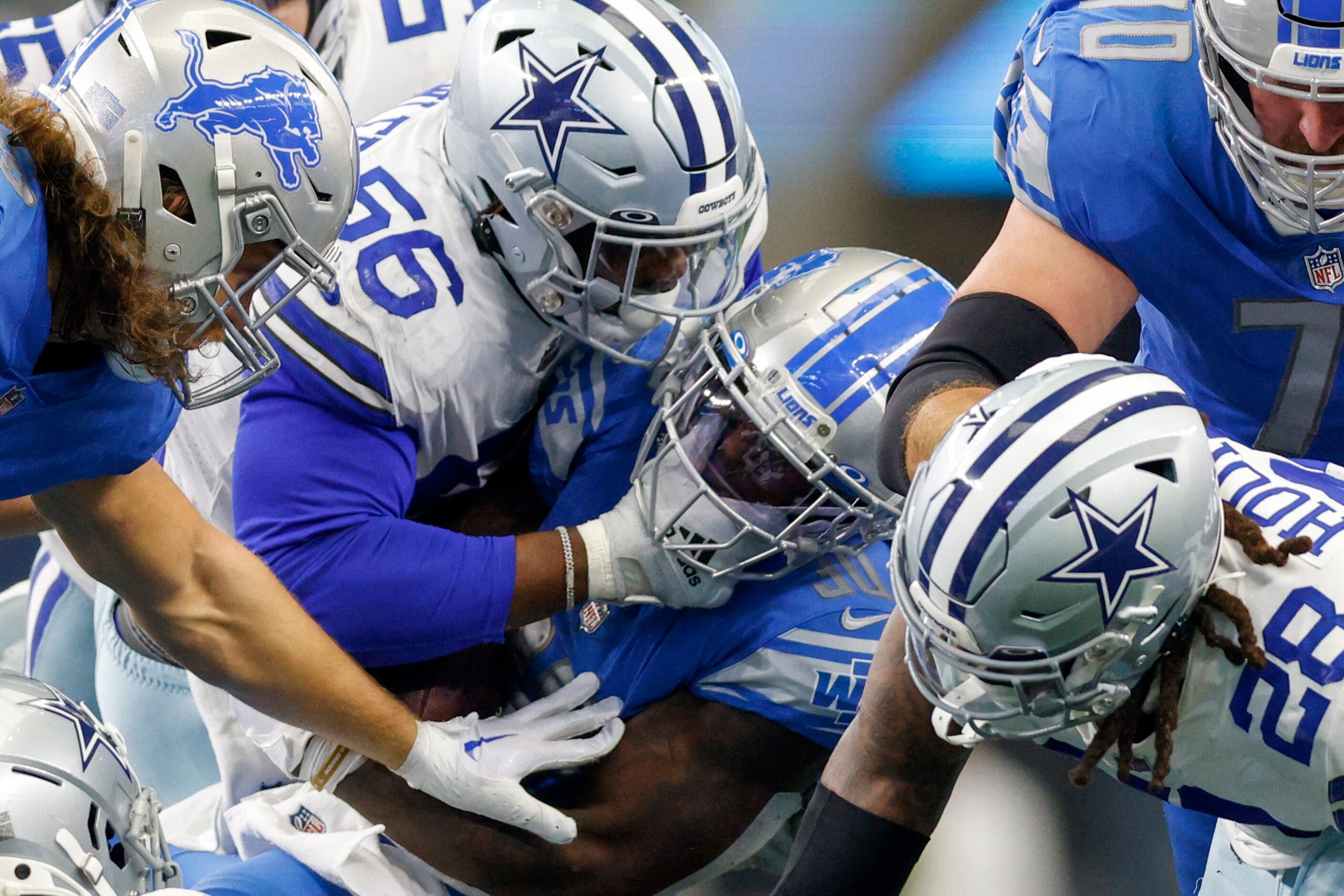 Dallas Cowboys defensive end Dante Fowler Jr. (56) tackles Detroit Lions running back Jamaal...