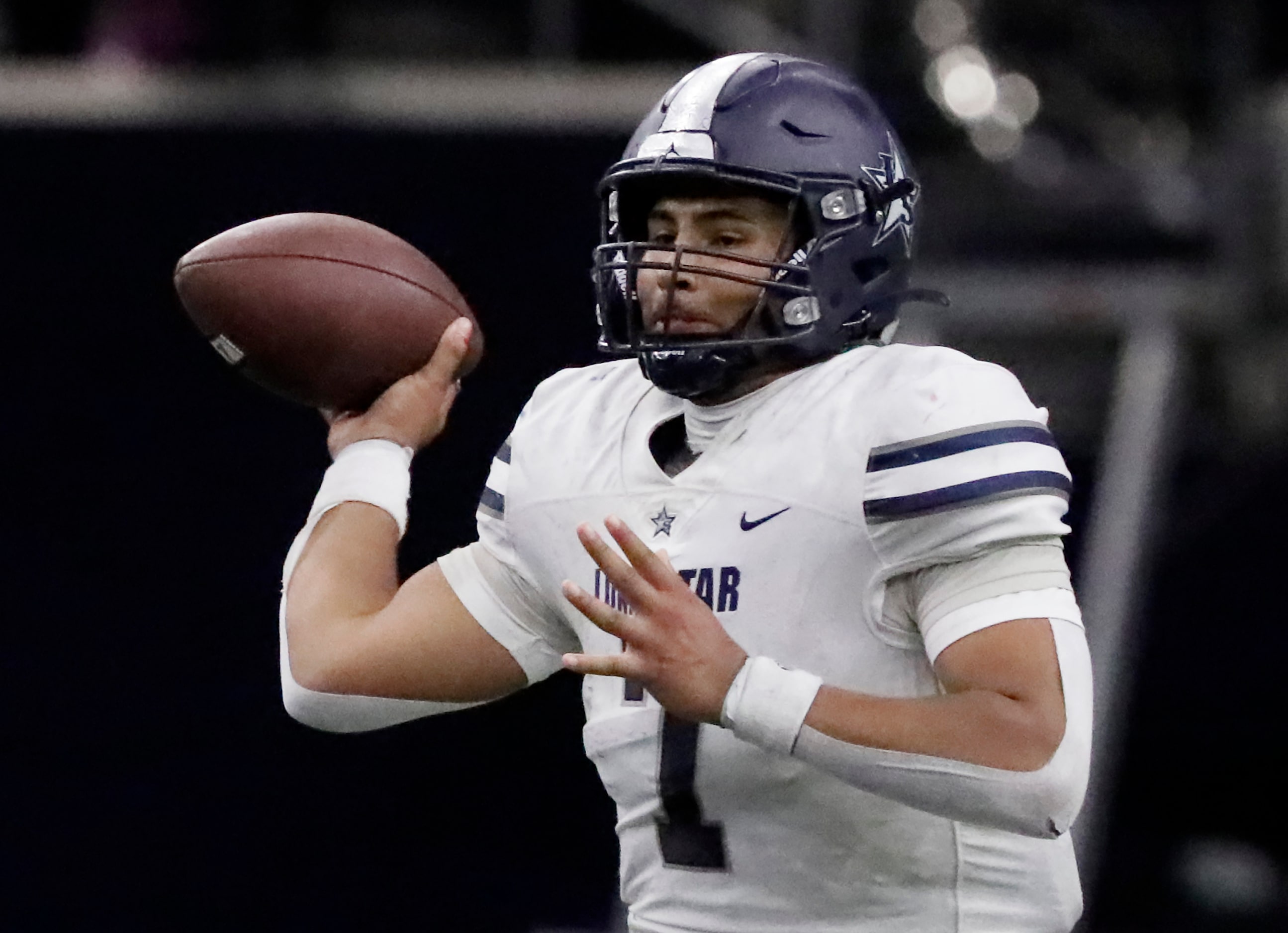 Lone Star High School quarterback Karece Hoyt (7) throws a pass during the first half as...